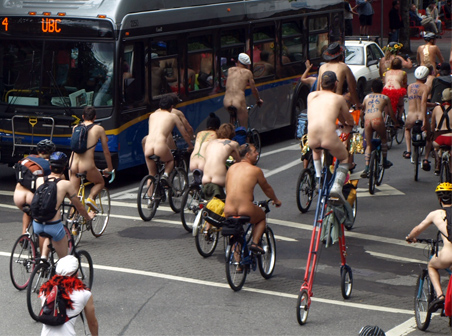 Nude Cyclists on Carrall Street Bus passengers motorists and tourists on